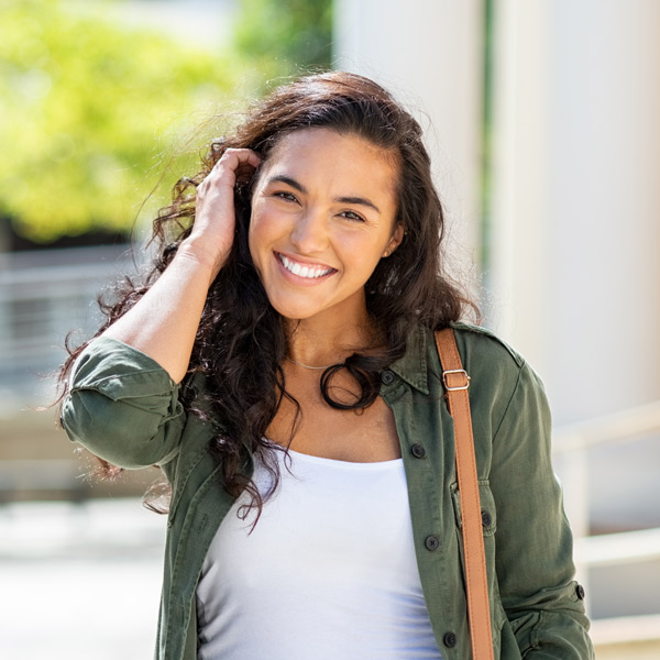young woman with brown hair smiling