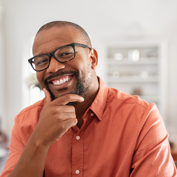 man in glasses smiling